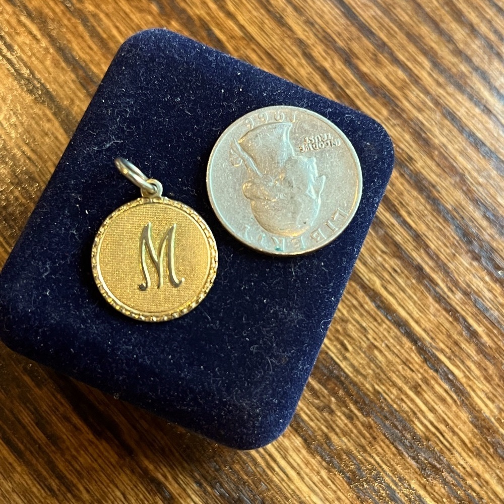 Gold M charm